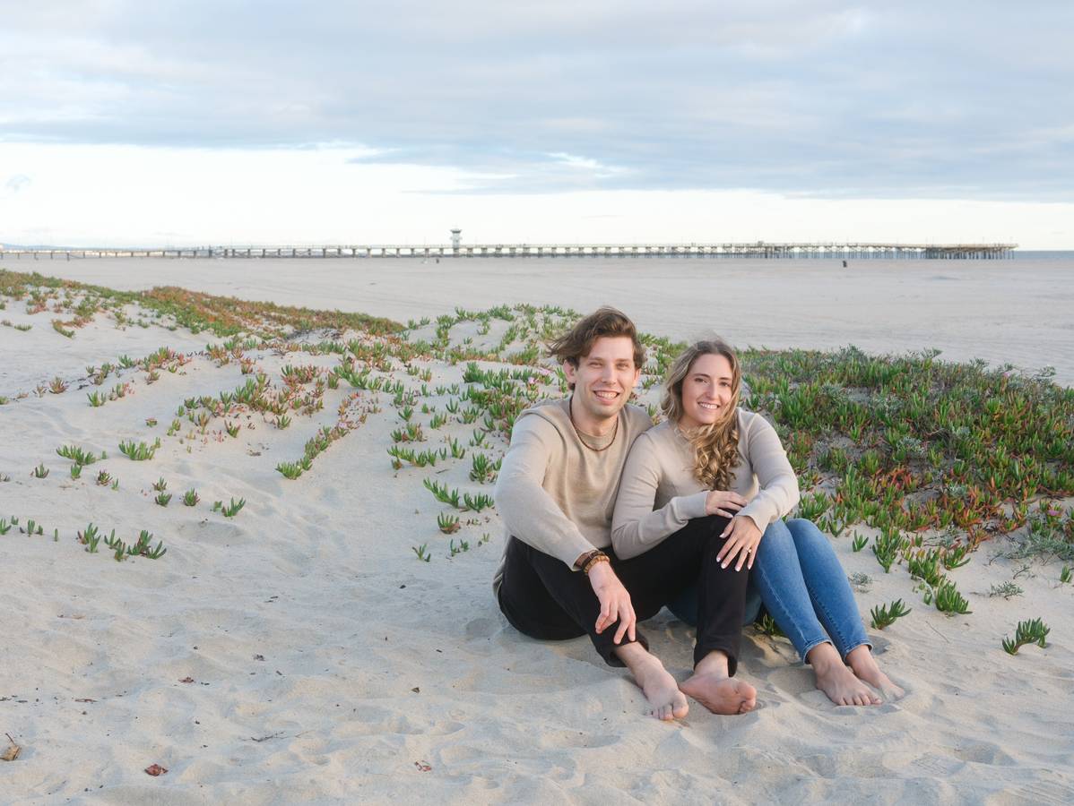 Taylor and his wife on the beach in Oahu
